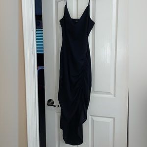 A Black Dress With Adjustable Leg Slip